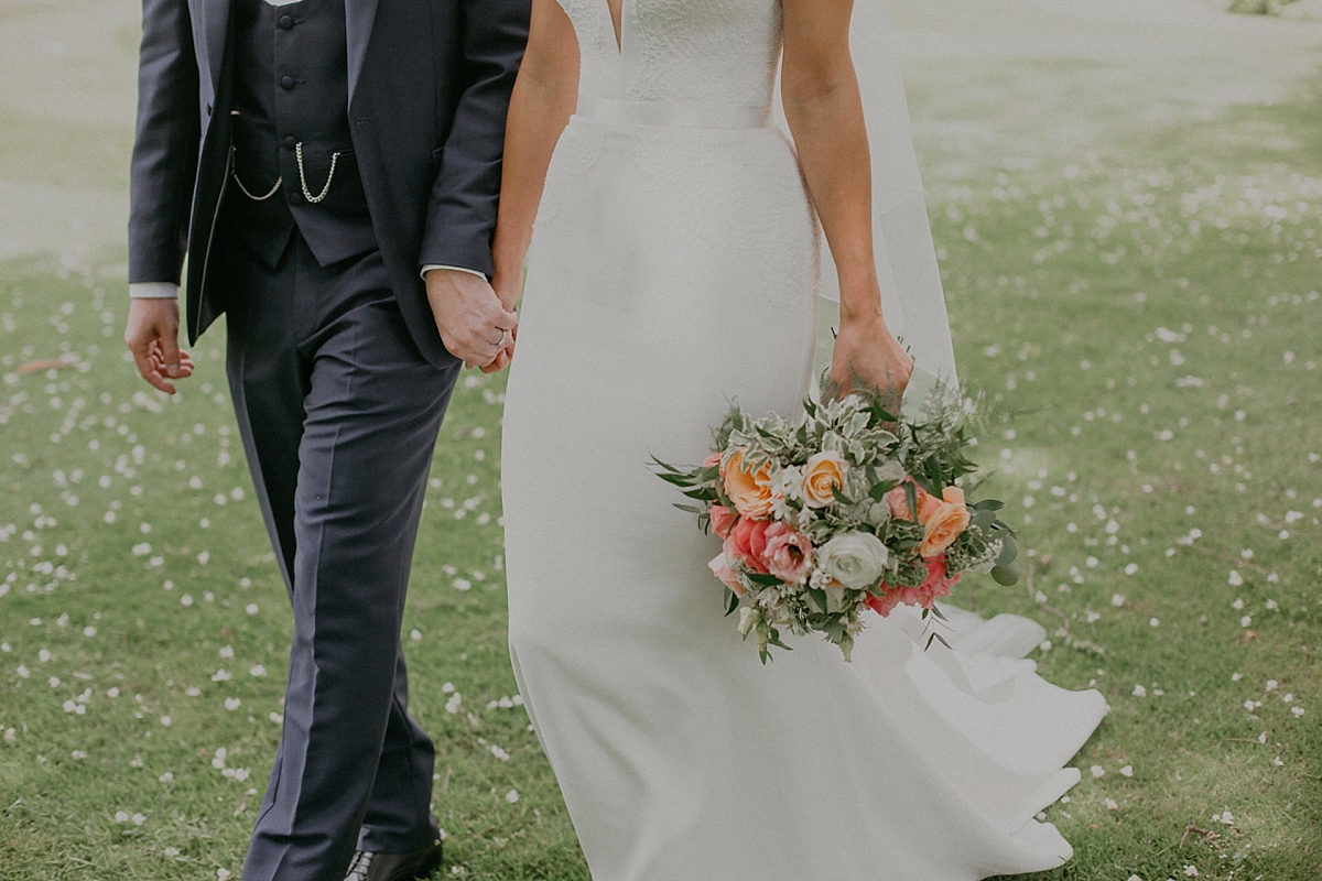 bride groom bouquet coral walking couple pose portrait