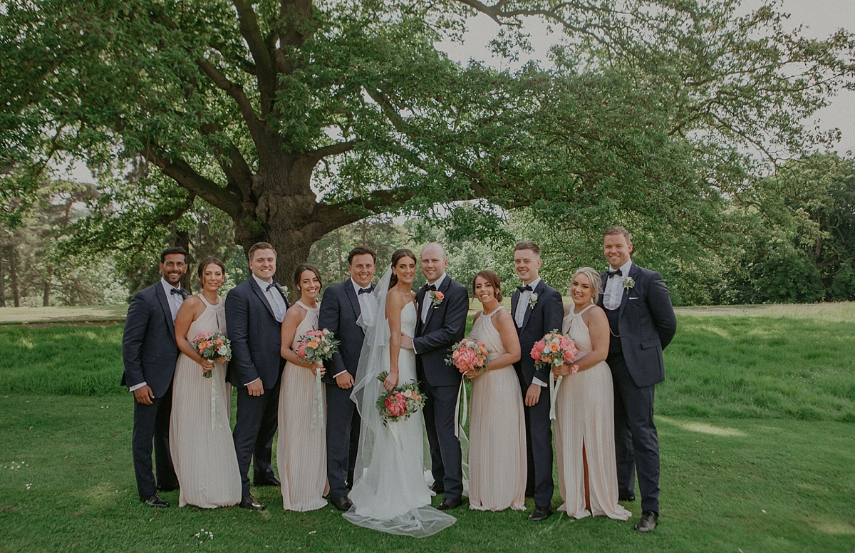 formal group shot bridesmaid groomsmen braxted park wedding essex photography