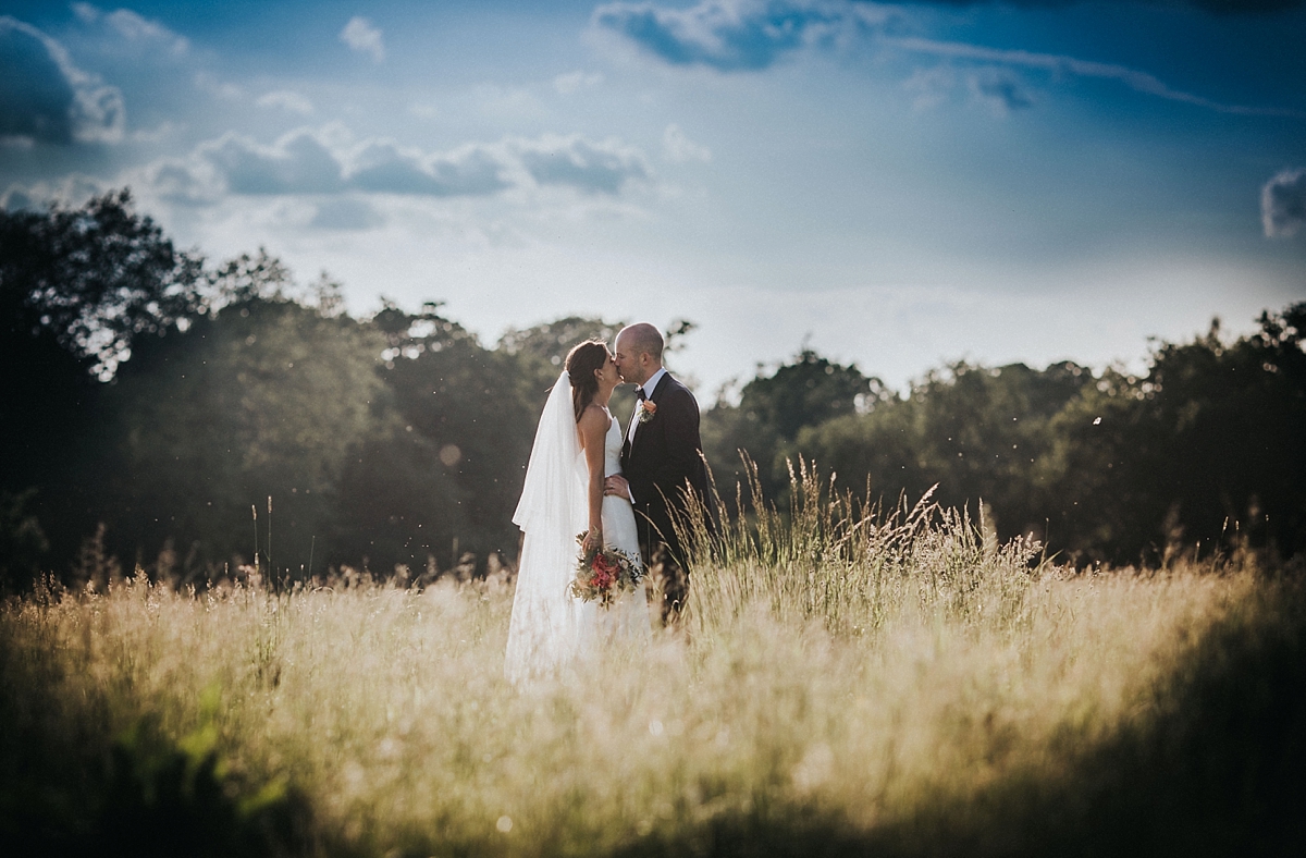 hay field braxted park essex bride groom kissing couple portrait photography