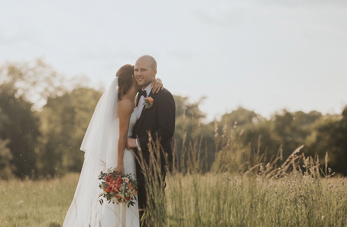 hay field braxted park essex bride groom kissing couple portrait photography