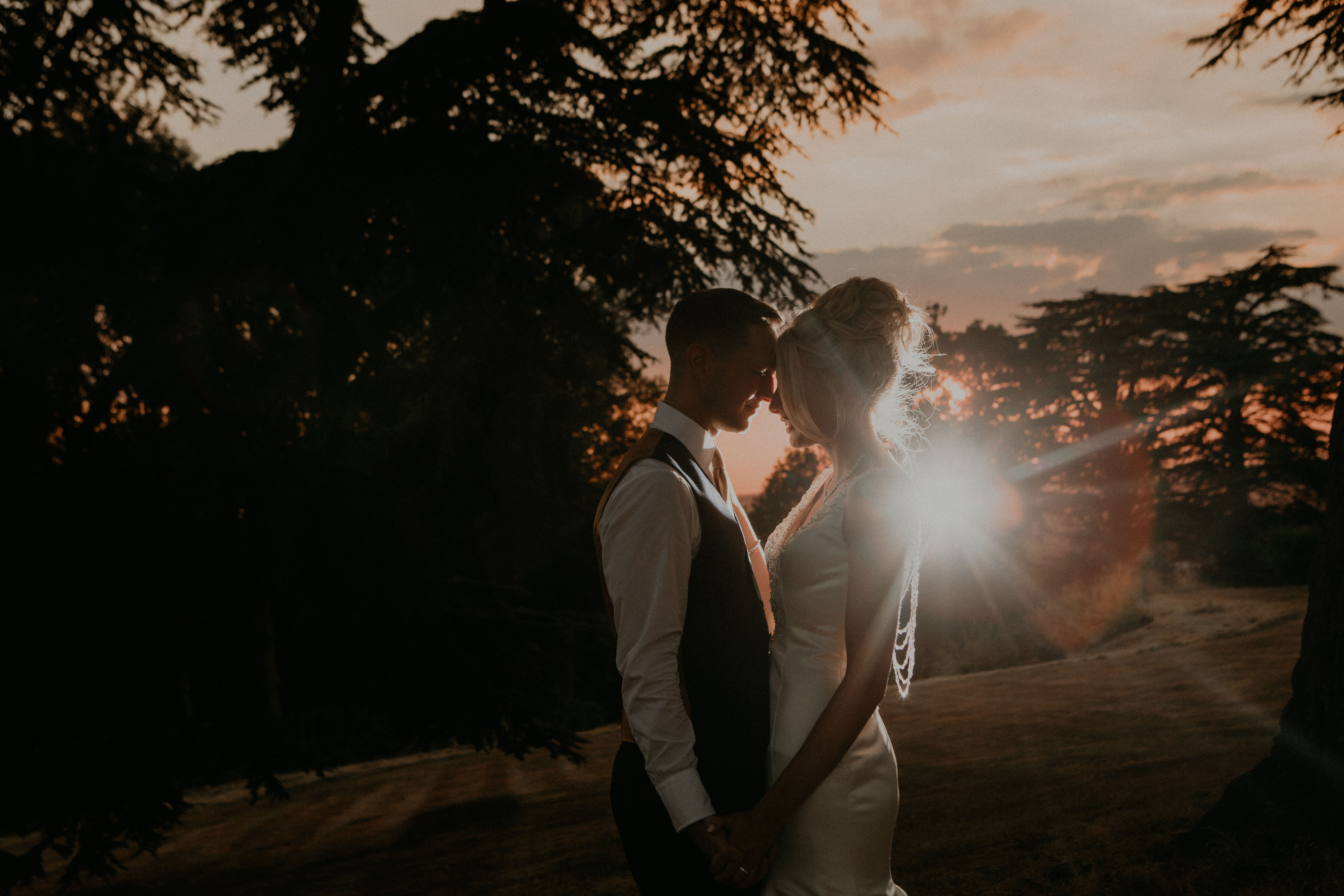 ocf off camer flash sunset Hedsor House wedding photography couple poses bride and groom