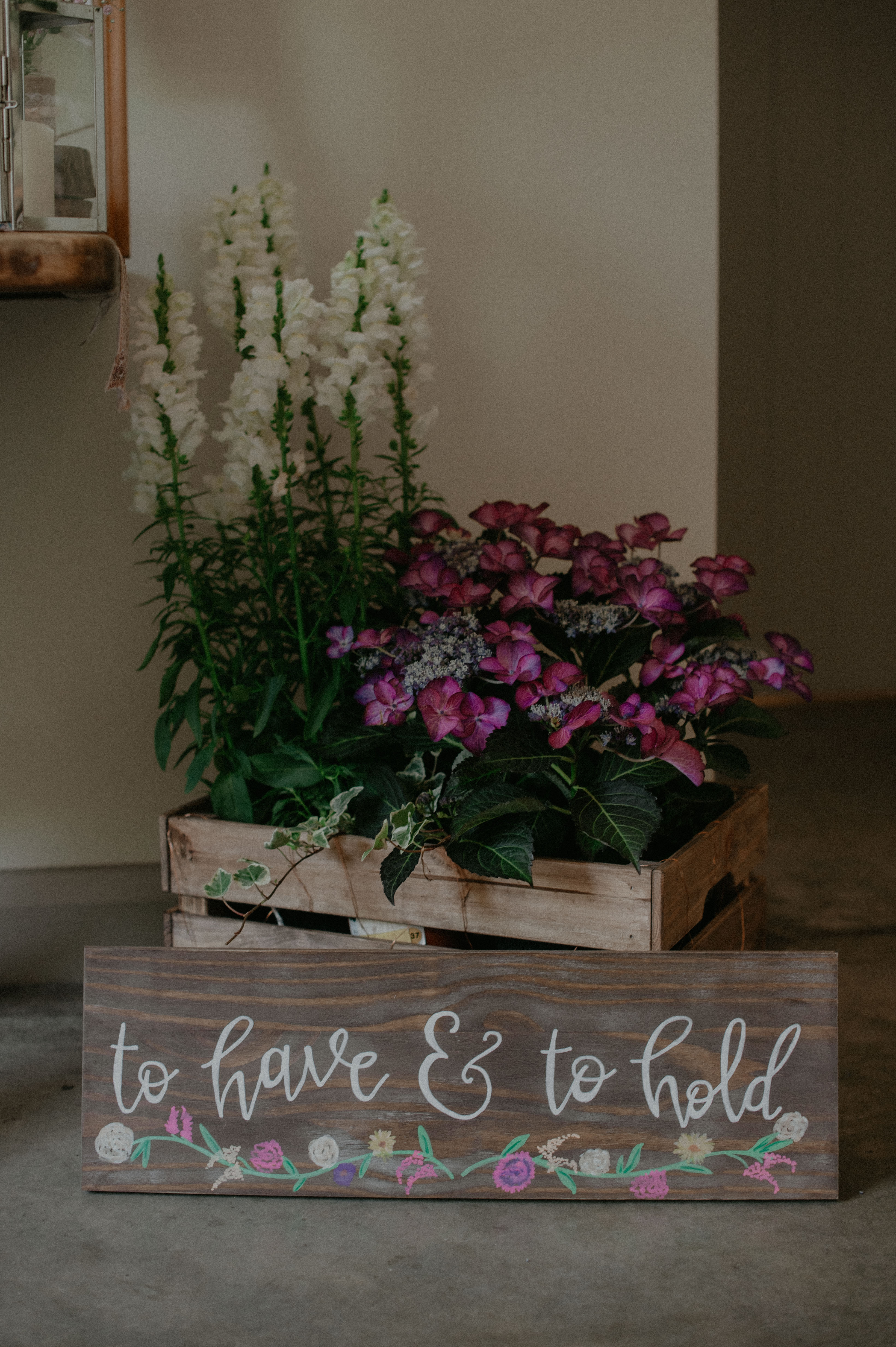 outdoor wedding ceremony decor crate with flowers to have and to hold sign