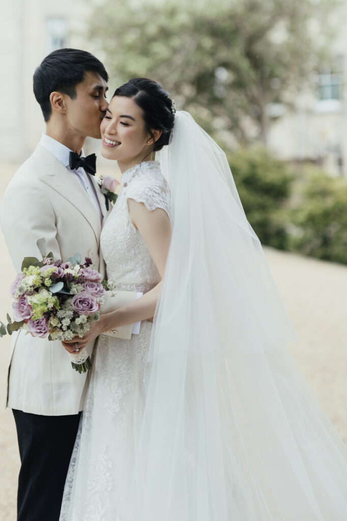 Bride with flowing veil in fine art editorial wedding portrait