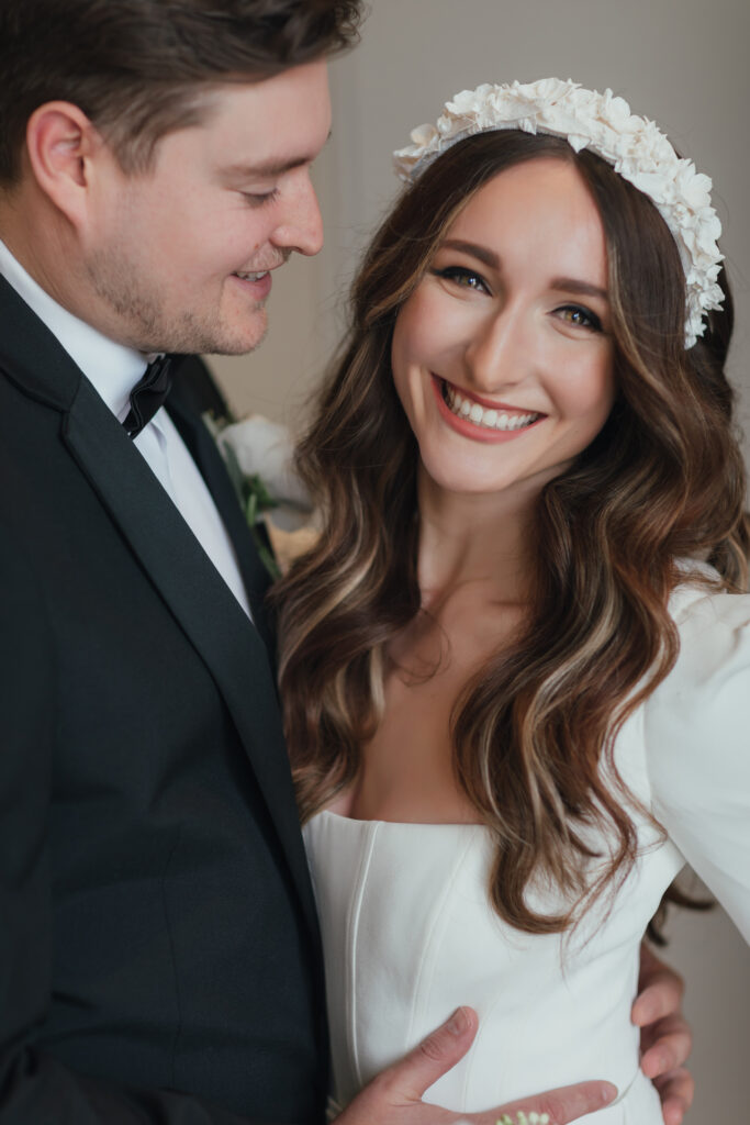Editorial wedding portrait of bride and groom in black tie