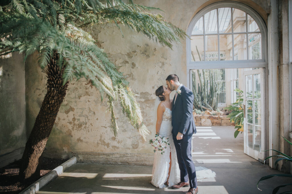 Romantic indoors portrait of bride and groom at Syon Park